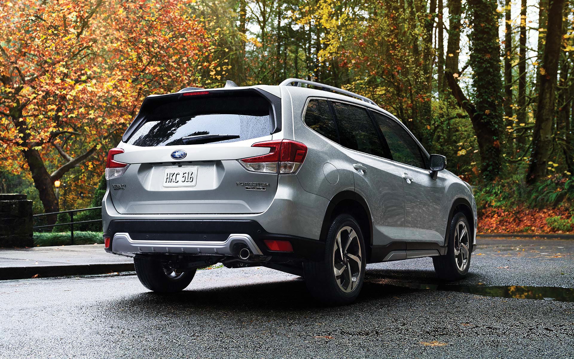 The rear of the 2022 Forester on a neighborhood street. | Briggs Subaru of Topeka in Topeka KS