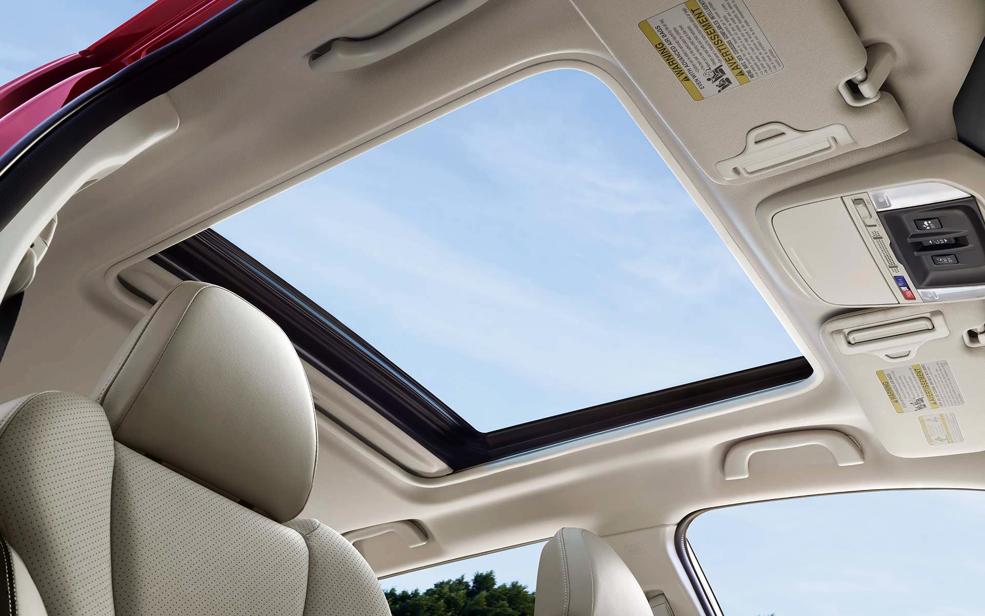 A view through the power sliding panoramic moonroof on the 2022 Forester Sport. | Briggs Subaru of Topeka in Topeka KS