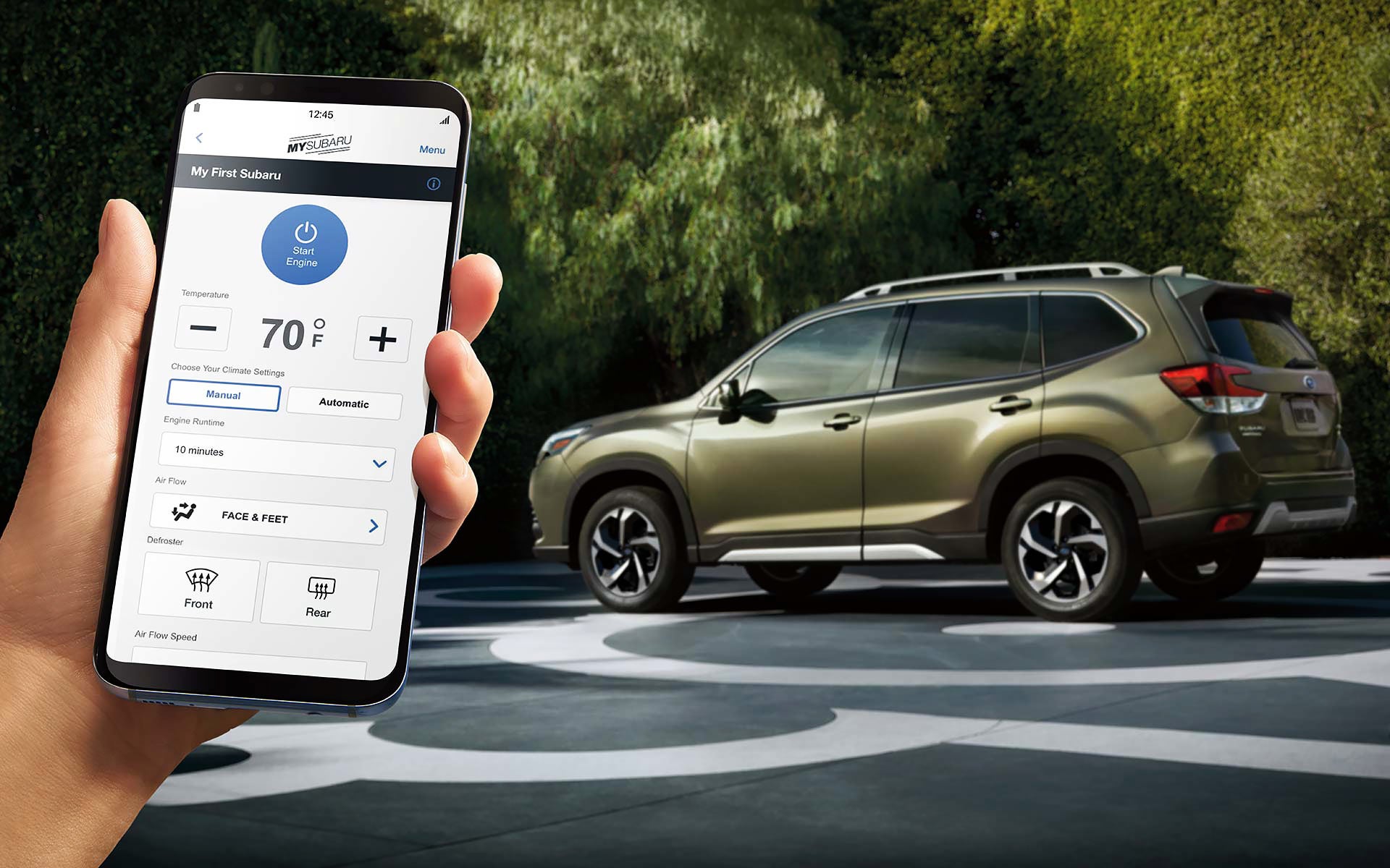 A close-up of a phone showing the Remote Engine Start with Climate Control feature of SUBARU STARLINK® Safety and Security available on the 2022 Forester. | Briggs Subaru of Topeka in Topeka KS