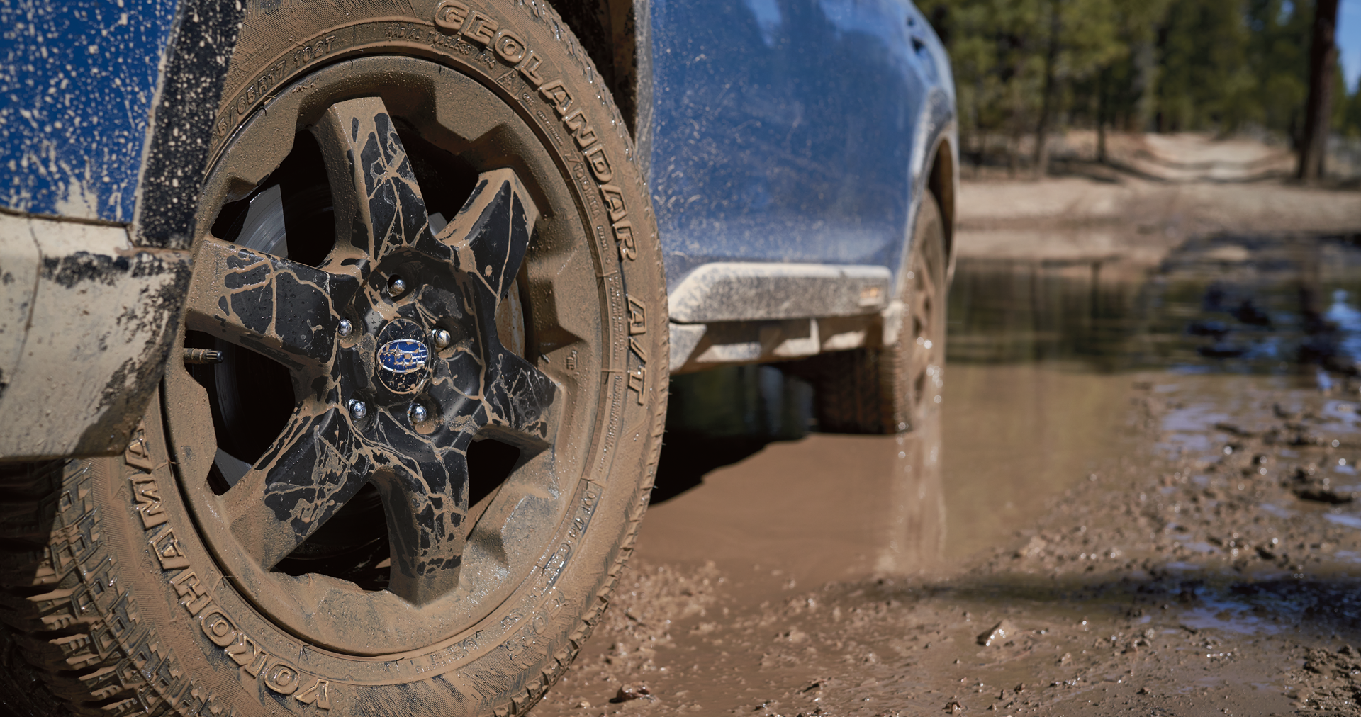 A close-up of the 17-inch off-road wheels and all-terrain Yokohama GEOLANDAR® tires on the 2023 Outback Wilderness. | Briggs Subaru of Topeka in Topeka KS