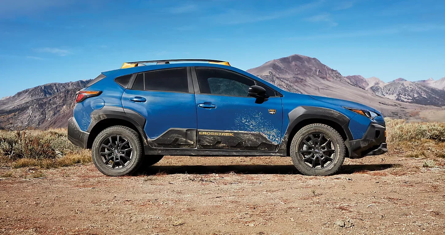 A Subaru Crosstrek Wilderness on a desert track.