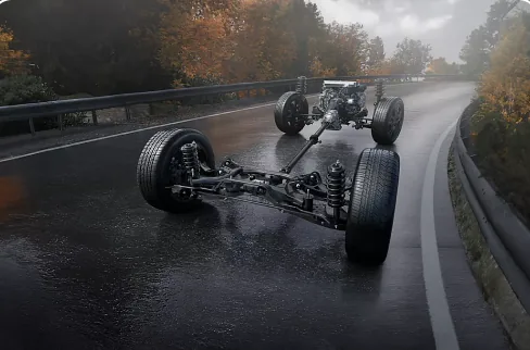 Subaru Symmetrical All-Wheel Drive drivetrain cutaway on a wet road