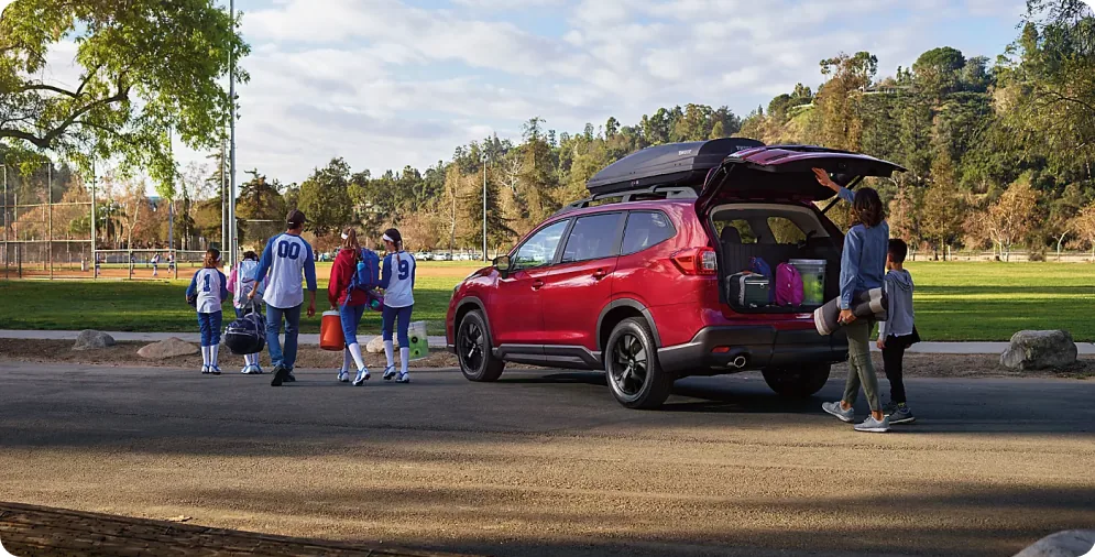 Family loading gear through the power rear gate of a 2026 Subaru Ascent