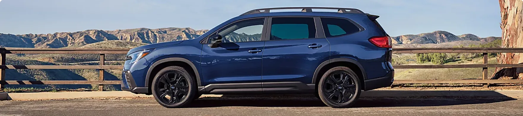 Blue 2026 Subaru Ascent Onyx Edition Touring parked at a canyon overlook