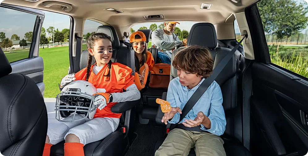 2026 Subaru Ascent with three rows of seating packed for a family trip