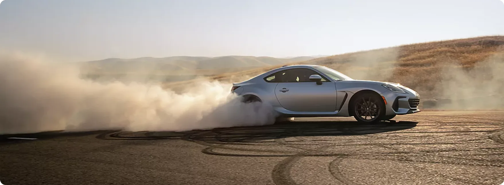 2026 Subaru BRZ sliding through a dusty corner in the hills