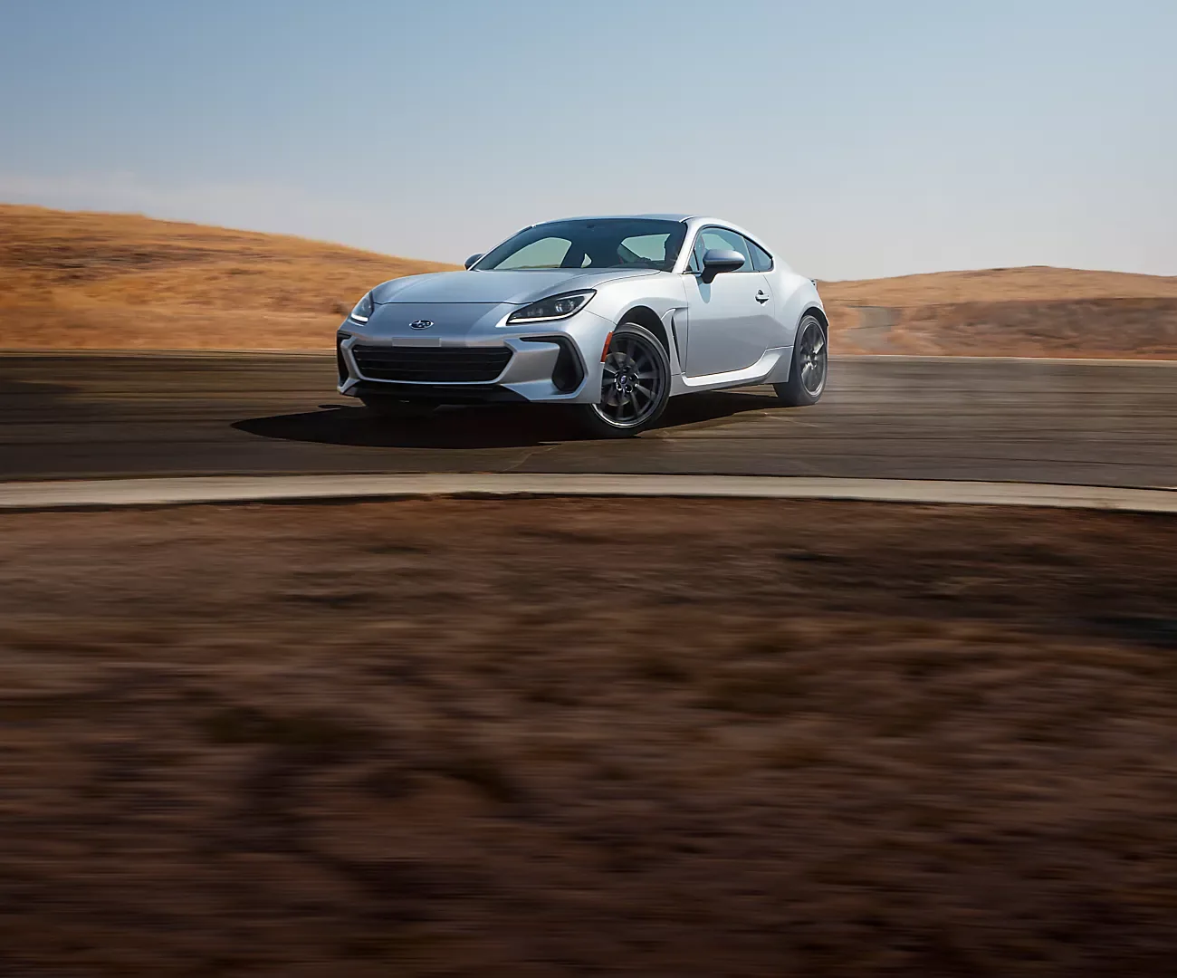Front three-quarter view of a silver 2026 Subaru BRZ at speed