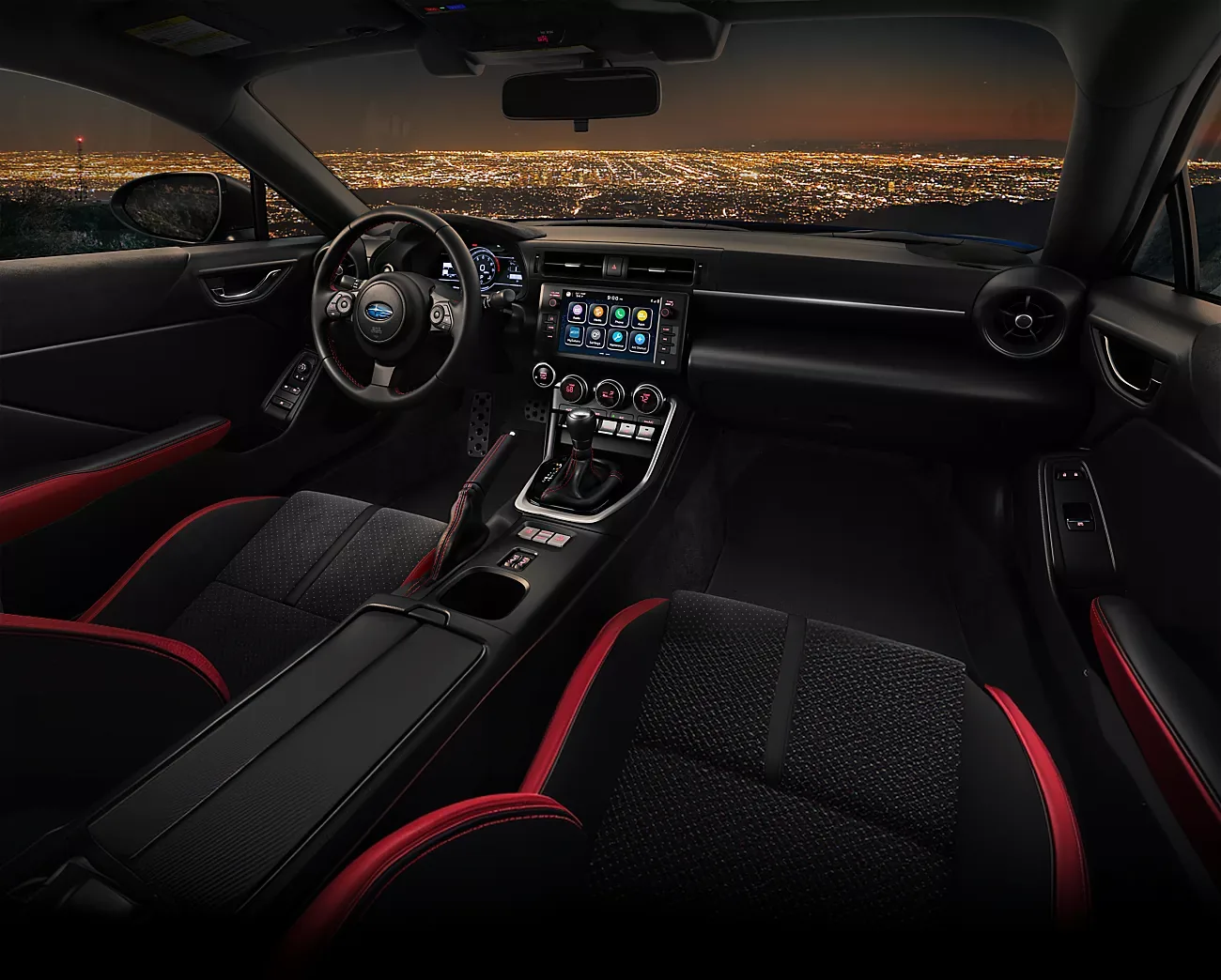 Driver-side view of the 2026 Subaru BRZ cockpit above the city lights