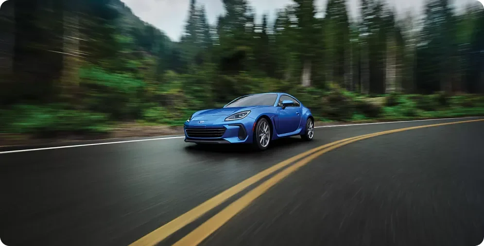 Rear three-quarter view of a 2026 Subaru BRZ on the road