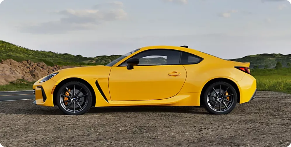 Side profile of the 2026 Subaru BRZ Series.Yellow on a coastal road