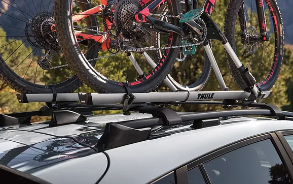 Mountain bikes carried on the roof rack of a 2026 Subaru Crosstrek