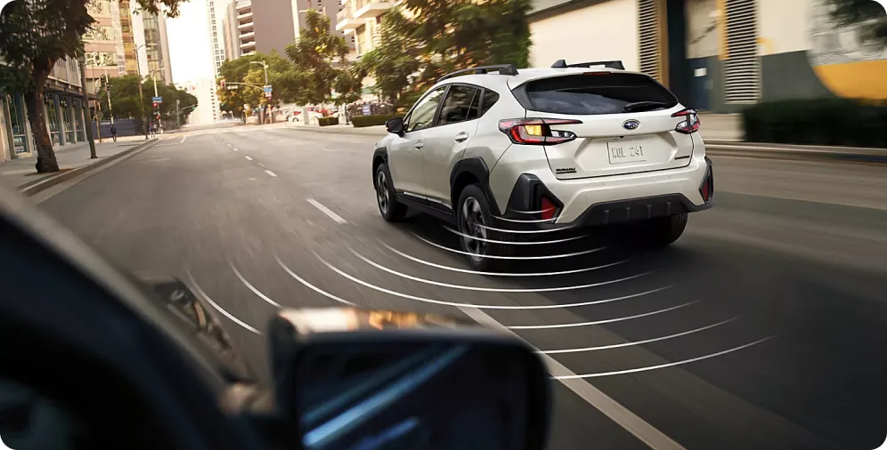 All-around awareness sensor field visualised around a white 2026 Crosstrek in the city