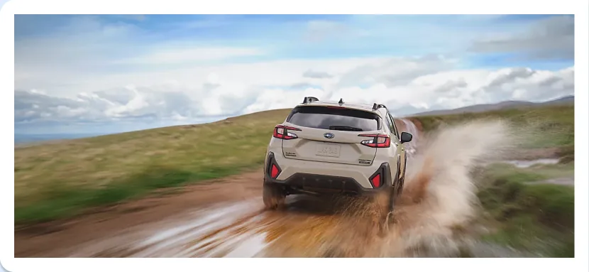 2026 Subaru Crosstrek Hybrid kicking up dust on an open plain