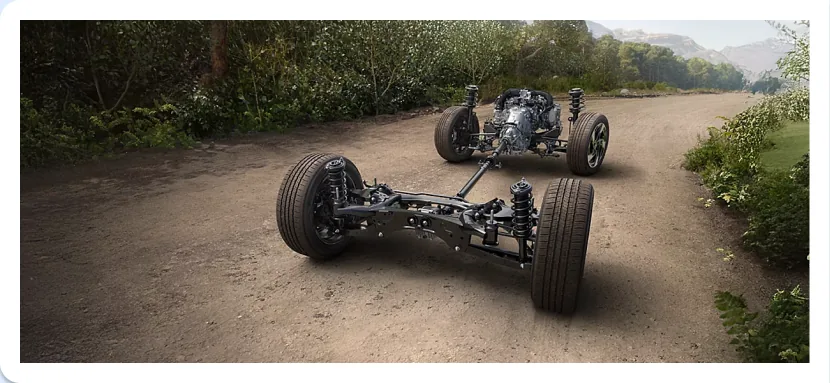 Subaru Symmetrical All-Wheel Drive drivetrain layout shown on a forest road