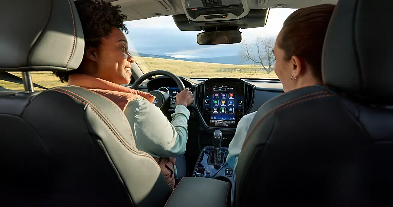 Driver and passenger in the cabin of the 2026 Subaru Crosstrek Hybrid