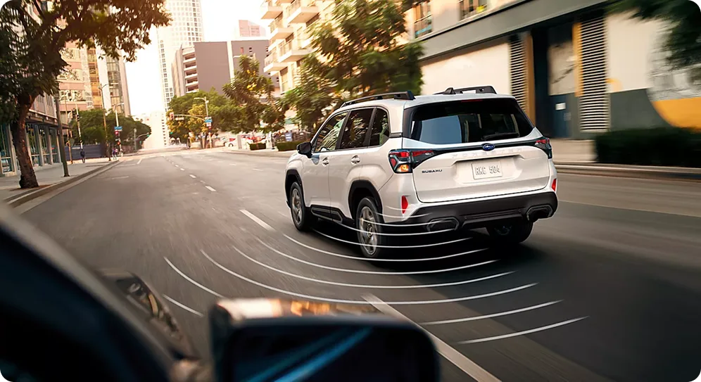 All-around awareness sensors visualised around a white 2026 Subaru Forester in city traffic