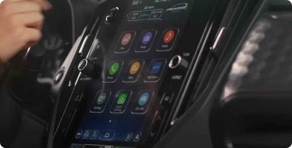 Driver selecting a drive setting on the 2026 Subaru Forester touchscreen