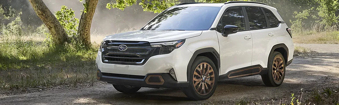 White 2026 Subaru Forester on a forest road