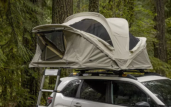 Rooftop tent mounted on a 2026 Subaru Forester in the woods