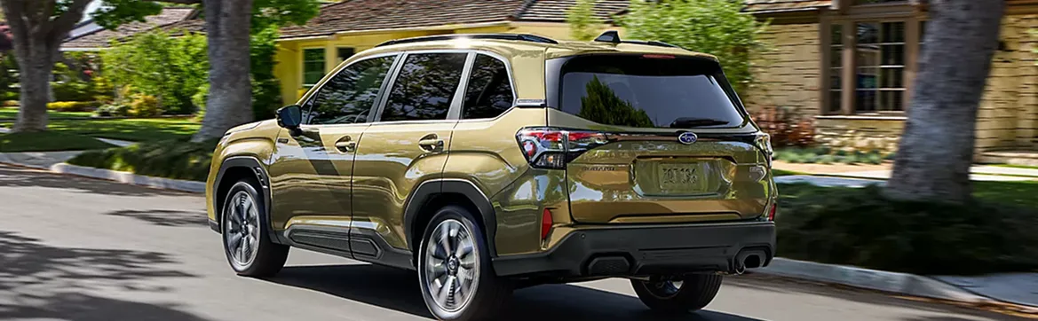 2026 Subaru Forester Hybrid with the rear gate open in a driveway