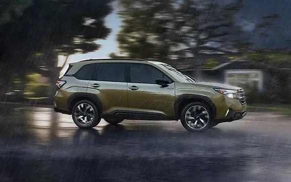 2026 Subaru Forester Hybrid driving on a wet road