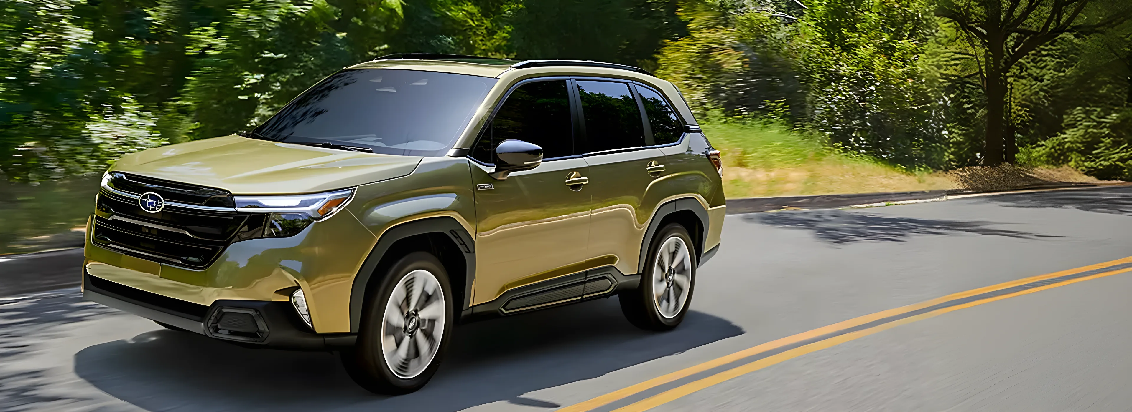 Olive green 2026 Subaru Forester Hybrid on a curving tree-lined road