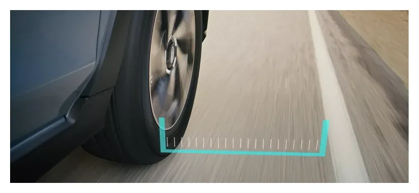 Lane Departure and Sway Warning tracking the lane marking beside a Subaru wheel