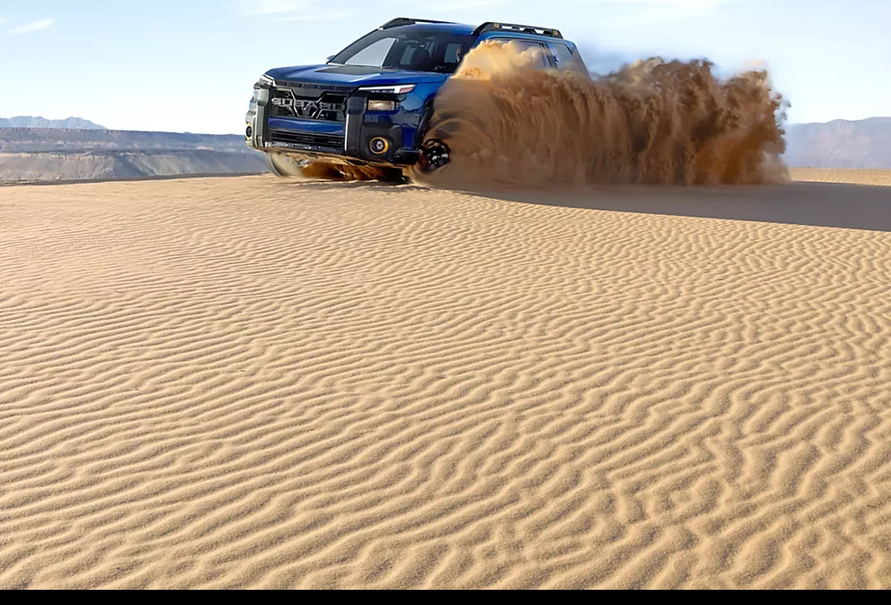2026 Subaru Outback Wilderness powering through desert sand