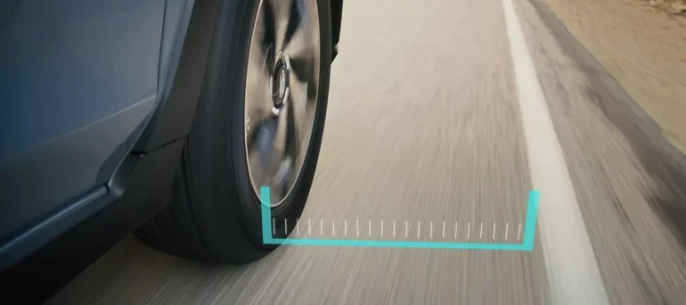Lane Departure and Sway Warning graphic beside a lane marking