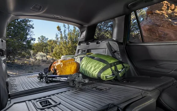 Rear cargo area of the 2026 Outback loaded with camping gear