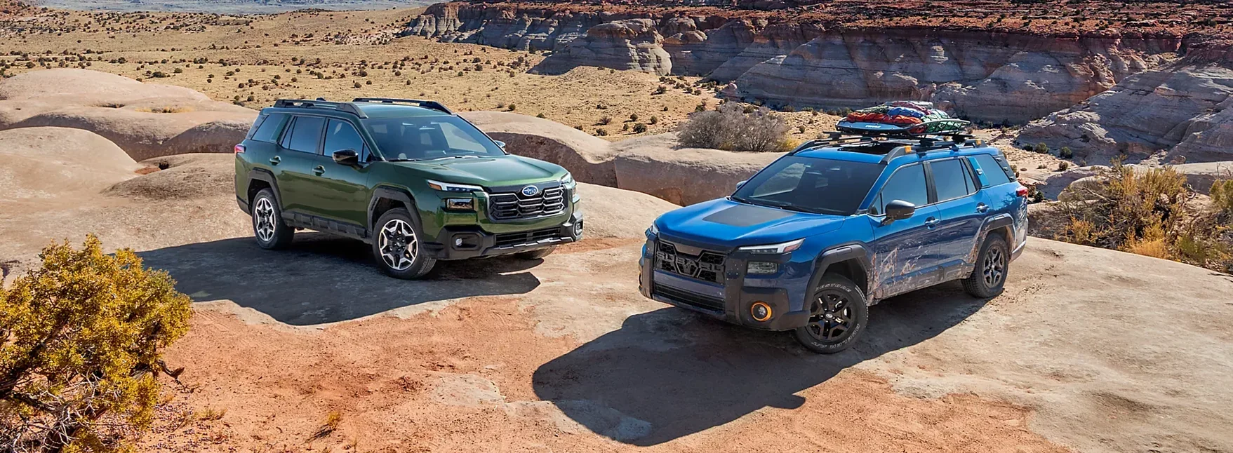 2026 Subaru Outback and Outback Wilderness parked on a canyon overlook