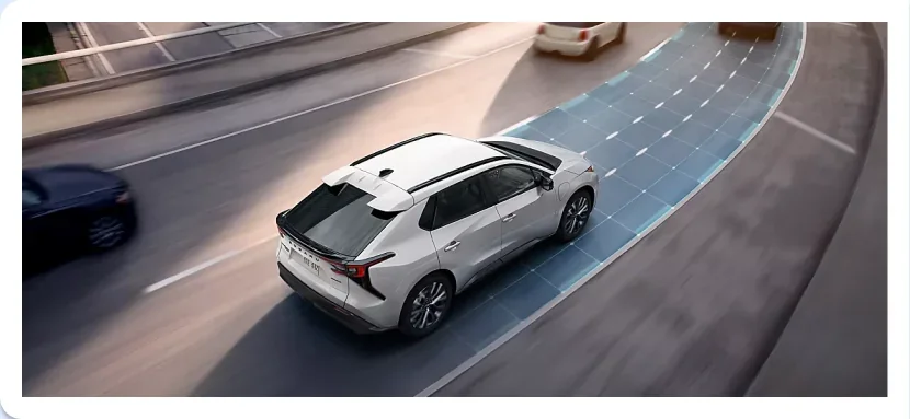 Traffic Jam Assist lane path visualised ahead of a 2026 Subaru Solterra on a highway