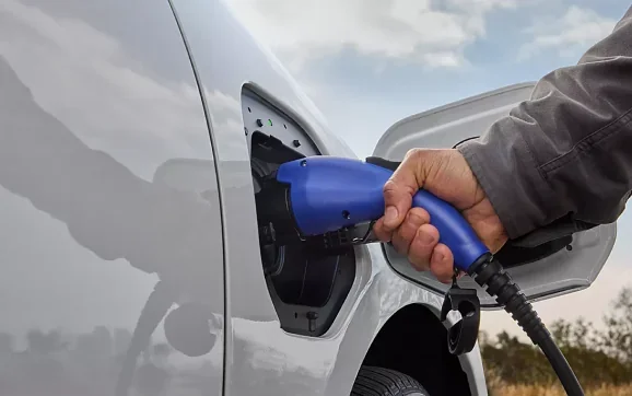 Charging cable plugged into the charge port of a 2026 Subaru Solterra