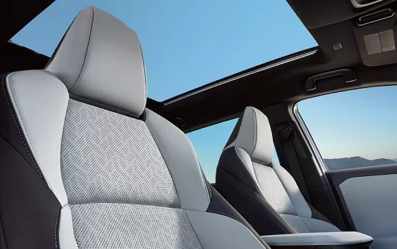 Front seats and panoramic glass roof inside the 2026 Subaru Solterra
