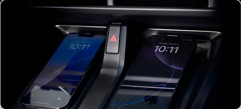 Two phones on the dual wireless device chargers of the 2026 Subaru Solterra
