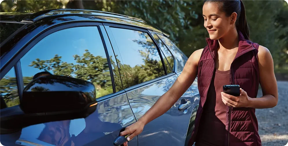 Driver unlocking a 2026 Subaru Solterra with a smartphone Digital Key
