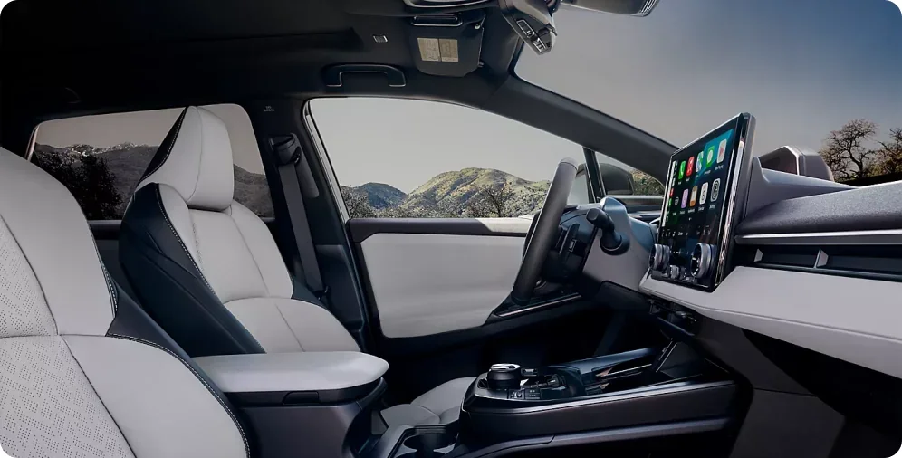 Light StarTex-trimmed front seats and dashboard of the 2026 Subaru Solterra XT