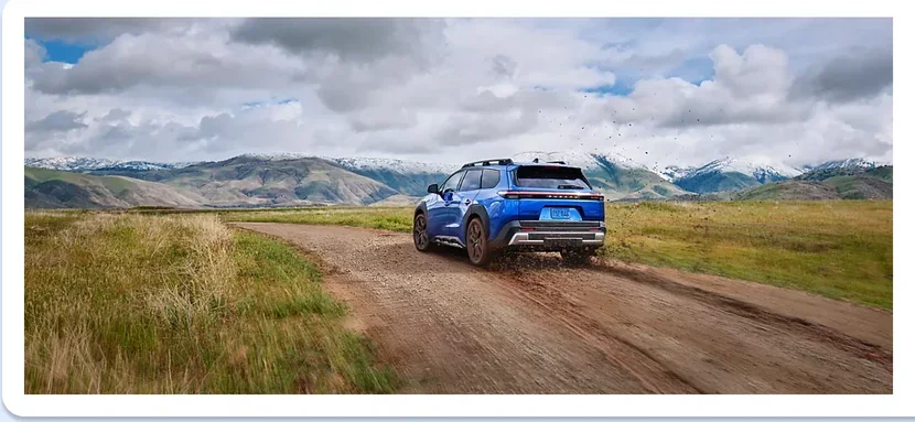 2026 Subaru Trailseeker heading away down a gravel road toward the mountains