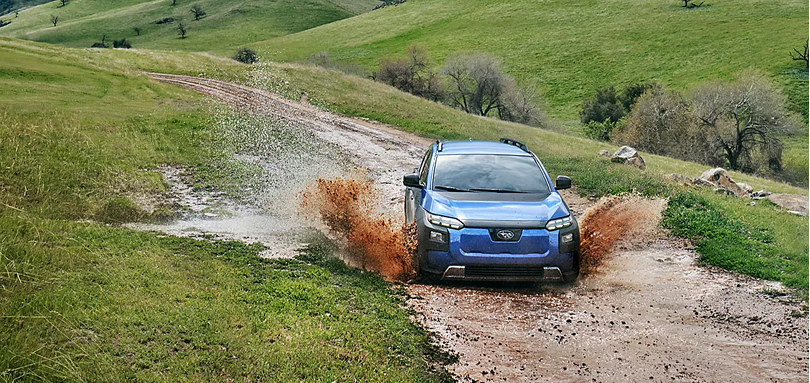 2026 Subaru Trailseeker throwing up mud on a rutted hillside track
