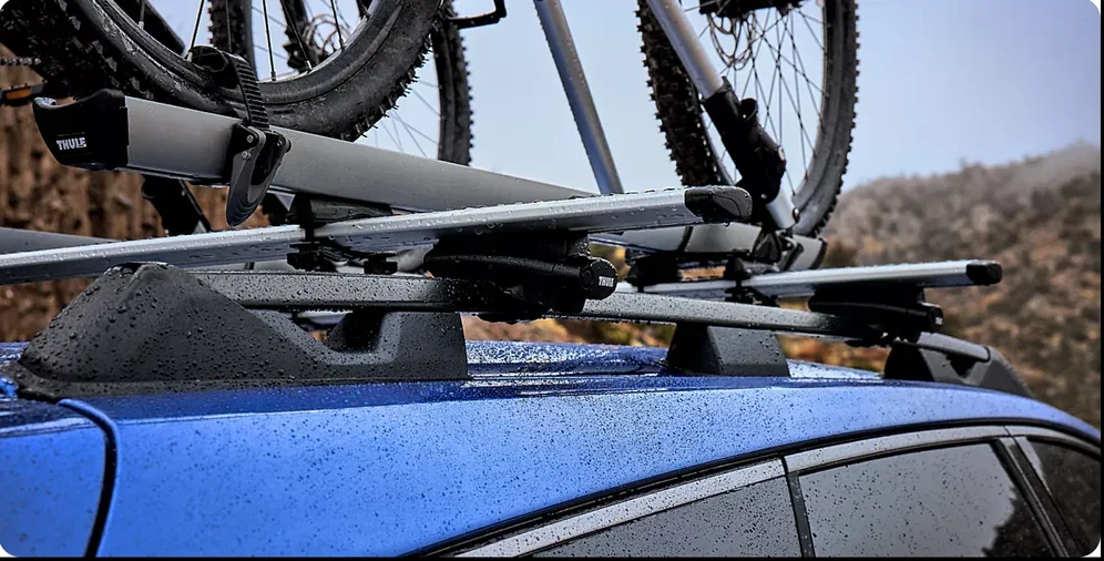 Mountain bikes mounted to the standard raised roof rails of a 2026 Subaru Trailseeker