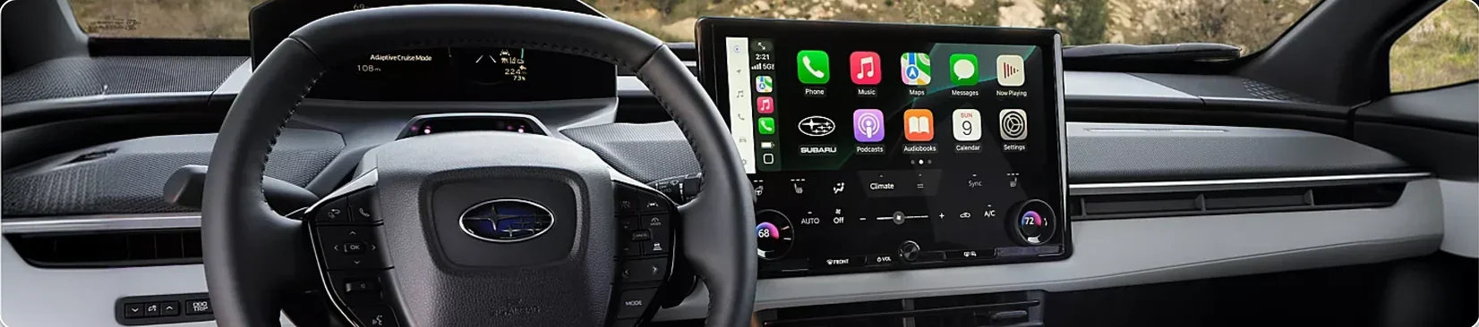 Steering wheel and 14-inch touchscreen running wireless Apple CarPlay