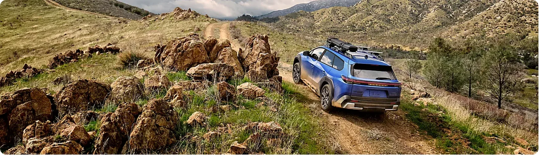 2026 Subaru Trailseeker climbing a rocky ridge trail in open country