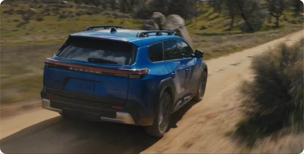 2026 Subaru Trailseeker travelling a back-country road with hands-free voice control in use