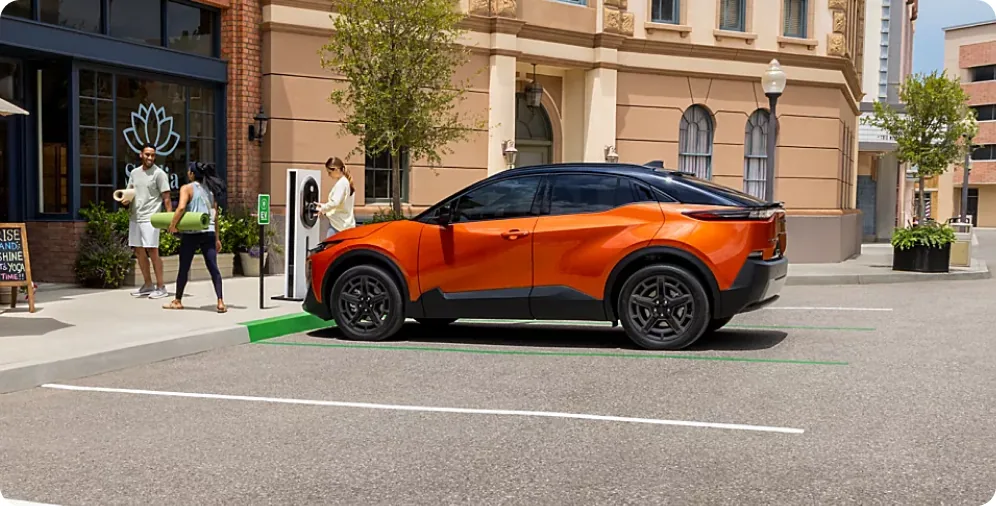2026 Subaru Uncharted plugged in at a public fast-charging station