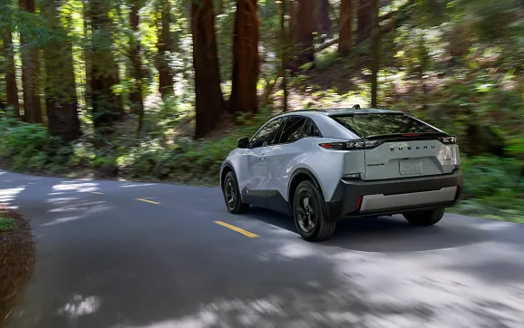 Rear view of a 2026 Subaru Uncharted on a redwood forest road