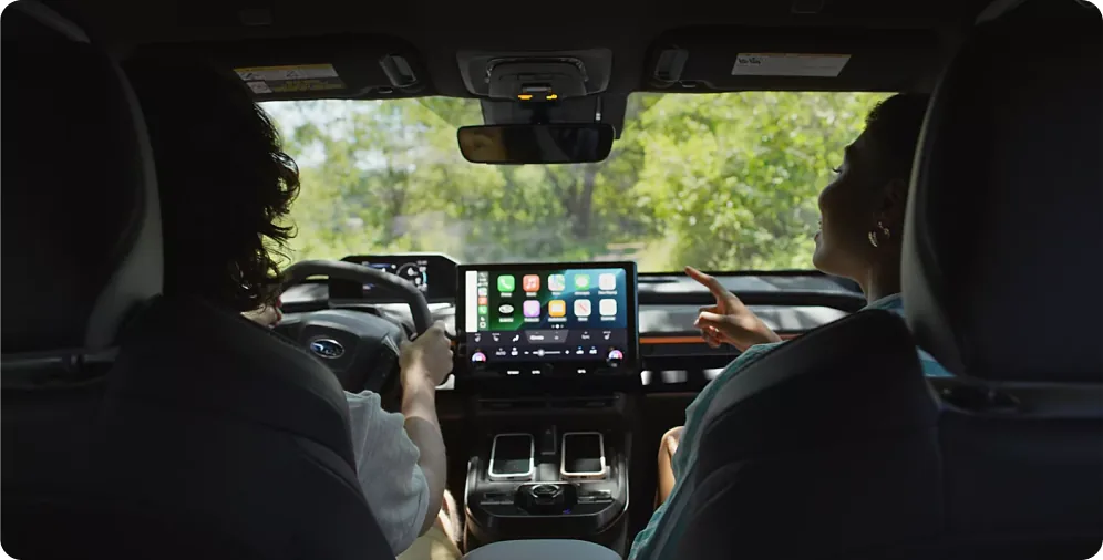 Driver using voice controls on the 2026 Subaru Uncharted touchscreen