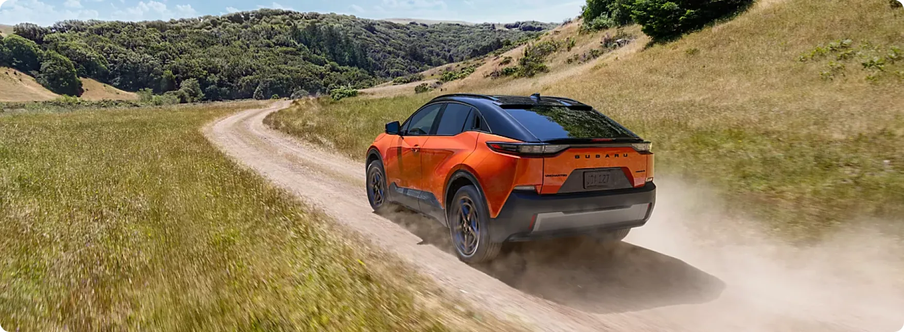 2026 Subaru Uncharted parked on a gravel overlook while a family unloads gear