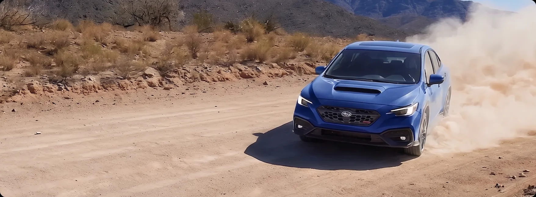 Blue 2026 Subaru WRX putting its Symmetrical All-Wheel Drive down on a gravel road