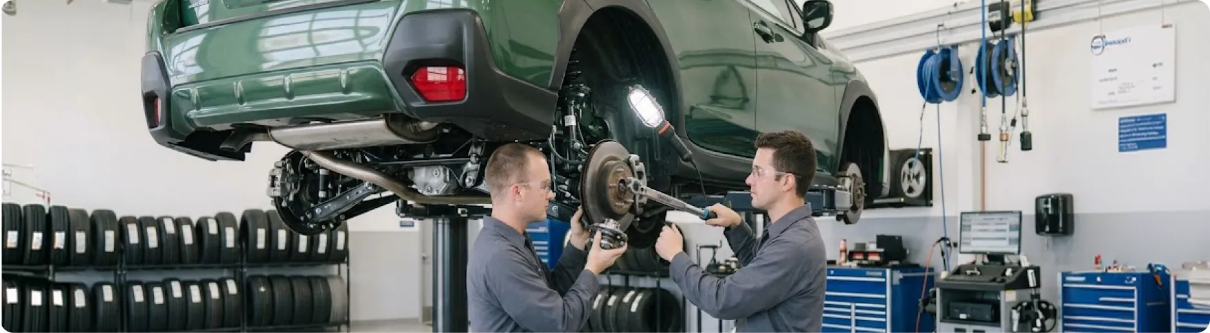 Subaru trained and certified technicians replacing suspension components on a Subaru at Briggs Subaru of Topeka