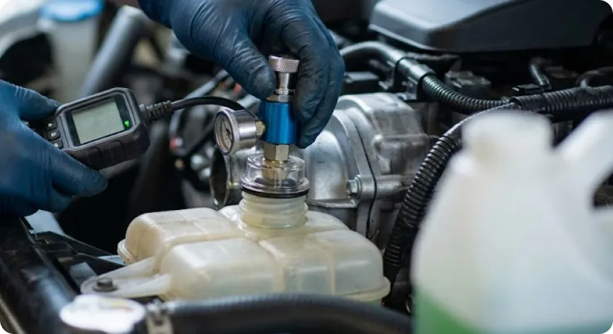 Briggs Subaru of Topeka technician pressure-testing the cooling system during thermal control valve service